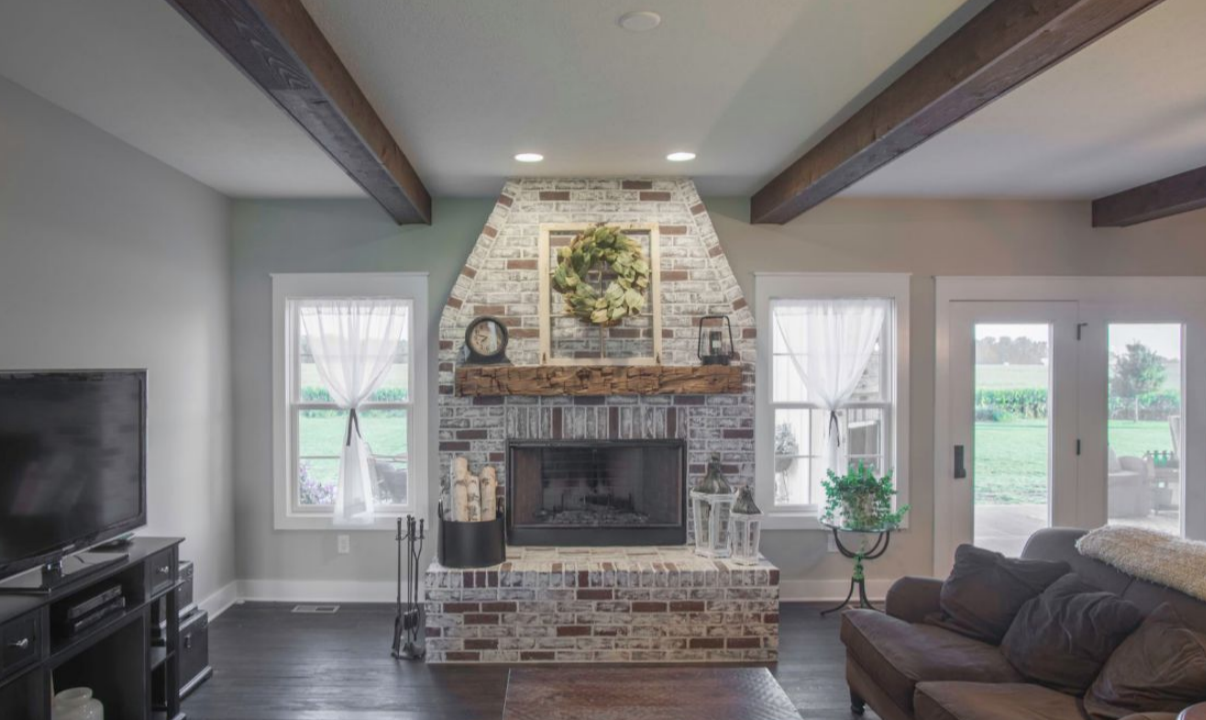 White brick fireplace in a custom home living room